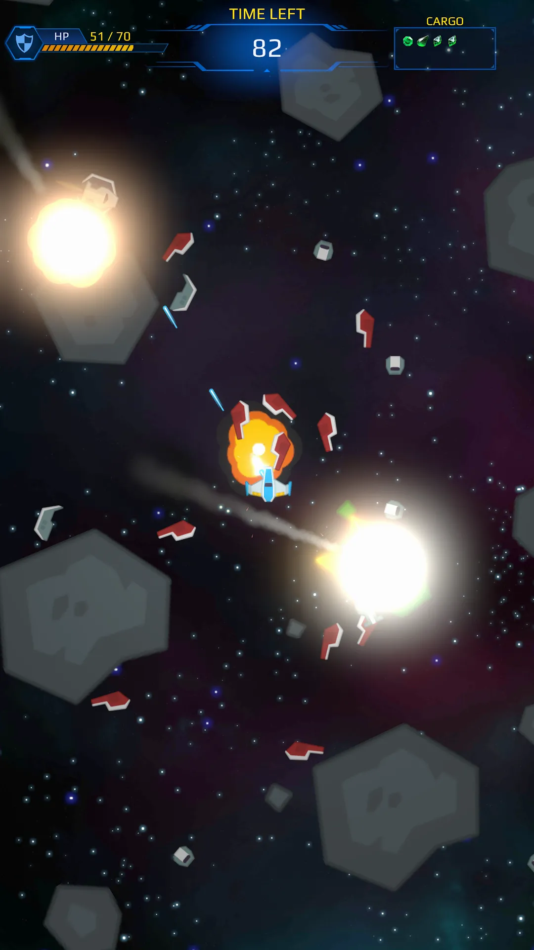 The player's ship weaving between two blazing explosions in a dense asteroid field.